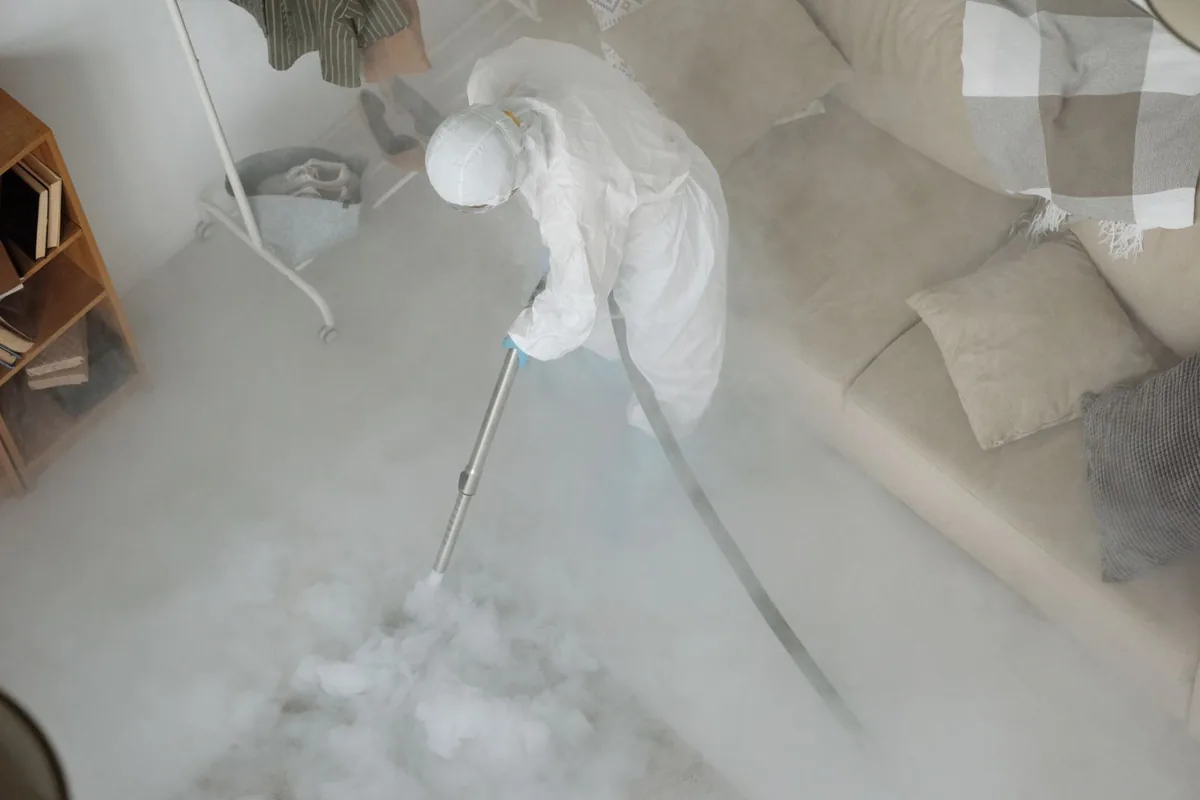 Biohazard cleanup technician in protective equipment, Indian River Shores, FL
